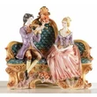 Ceramic sitting couple. Color: gold