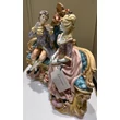 Ceramic sitting couple. Color: gold