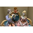 Ceramic sitting couple. Color: gold