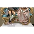 Ceramic sitting couple. Color: gold