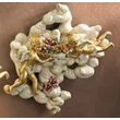 Cloud-shaped ceramic ornament with angels, painted ceramic.