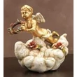 Ceramic angel playing on a cloud.