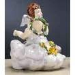 Ceramic angel playing on a cloud.
