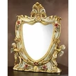 Ceramic table mirror with angels.