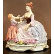 Ceramic mother with child, painted porcelain