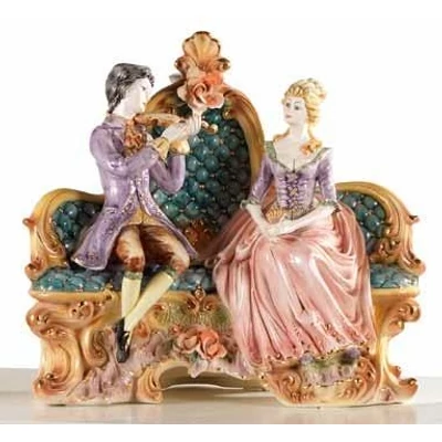 Ceramic sitting couple. Color: gold