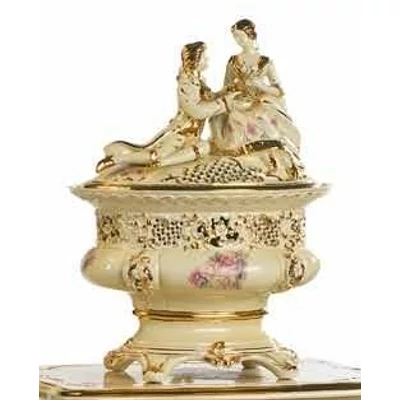 Oval ceramic bonbonier with couple. Color: cream color, gold