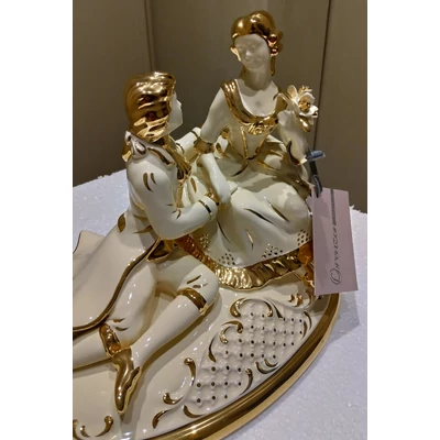 Oval ceramic bonbonier with couple. Color: cream color, gold