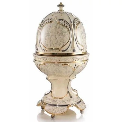 Egg-shaped ceramic container with openable top, with wheels, with built-in piston and with lighting.