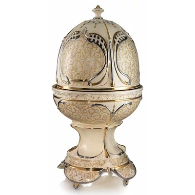 Egg-shaped ceramic container with openable top, with wheels, with built-in piston and with lighting.