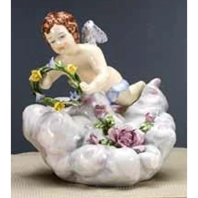Ceramic angel playing on a cloud.