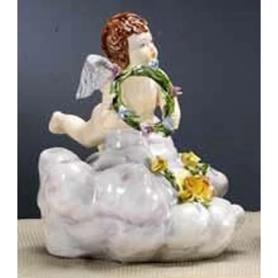 Ceramic angel playing on a cloud.