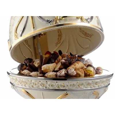 Small egg-shaped ceramic container with built-in piston. Color: cream color, gold, platinum