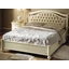 Siena Double bedstead with metal decorative insert and capitonné padding, with short footboard