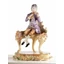 Ceramic boy sitting on piano. Color: gold