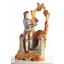 Ceramic man with decorative arc. Color: gold