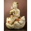 Ceramic angel playing on a cloud with candle-holder. Color: cream color, gold