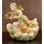 Ceramic angel playing on a cloud. Color: cream color, gold